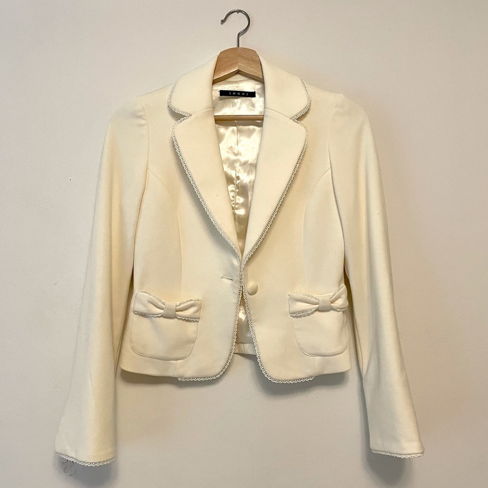 White blazer with bow pockets